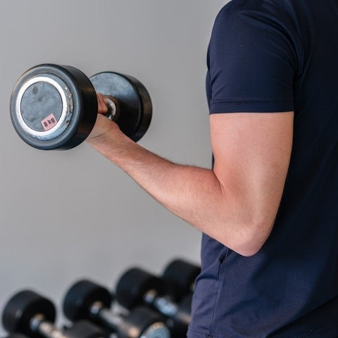 A man holding a dumbbell